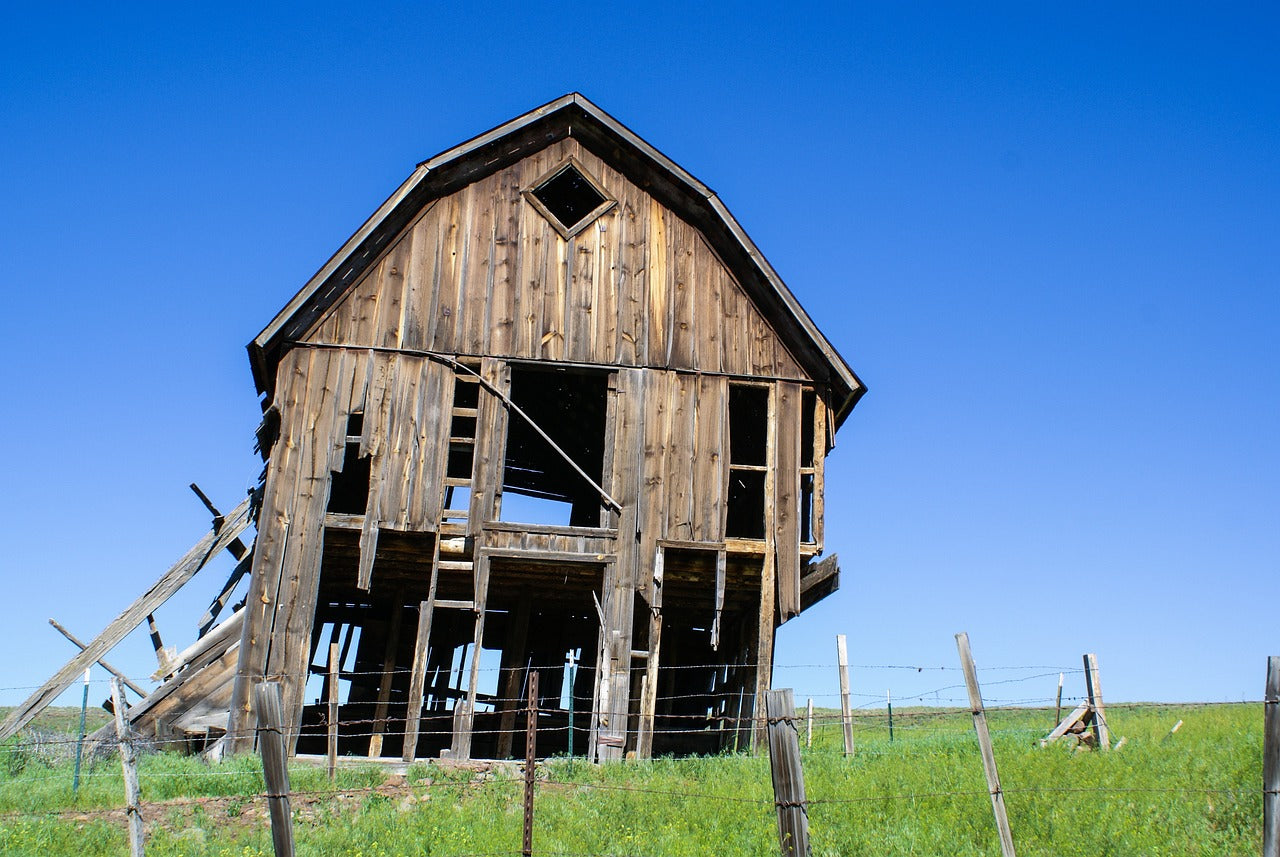 old barn wood. barn is about to fall. you can see barn like these all across america